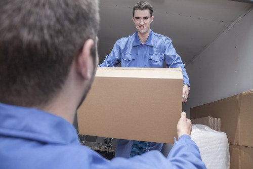 Moving boxes and a removal van during a Peckham home move