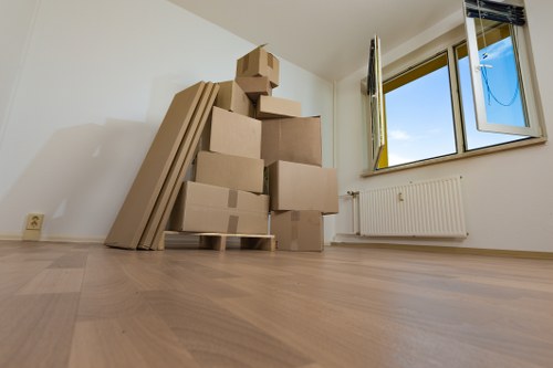 Removal van and moving team in a Peckham street setting