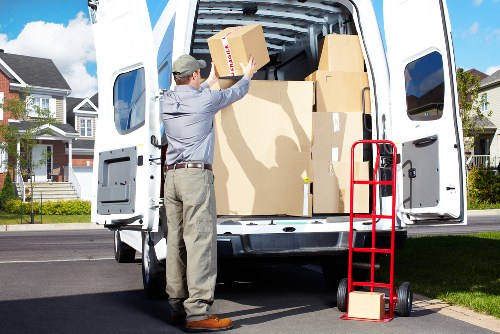 Removal team packing and transporting boxes for a local Peckham home move