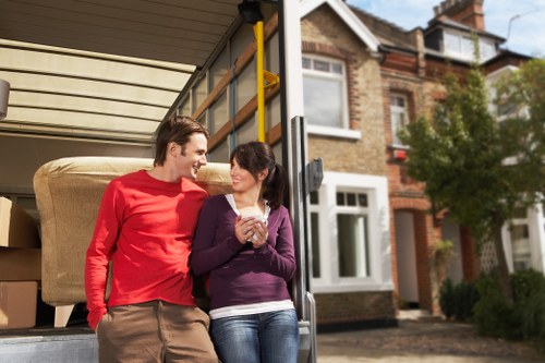 A moving team handling bulky furniture removals in Peckham